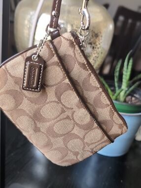 Coach Tan and Brown Signature Canvas Wristlet.Used Excellent Condition.